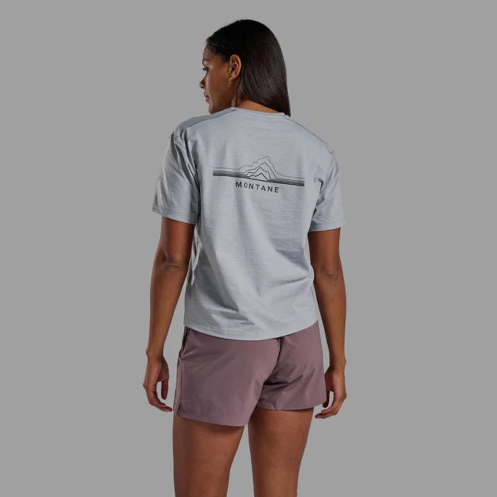Back view of a person wearing a light gray Montane T-shirt with a logo on the back and mauve shorts against a neutral gray background.
