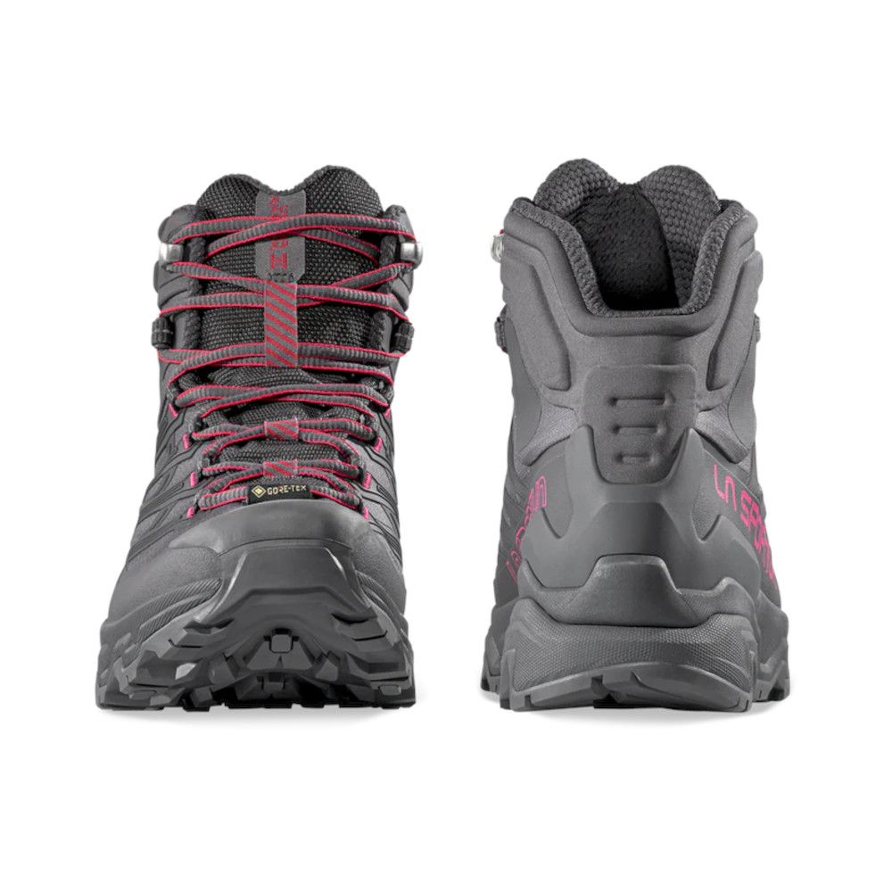 Pair of gray hiking boots shown from the front and back, with pink laces and rugged outsoles.