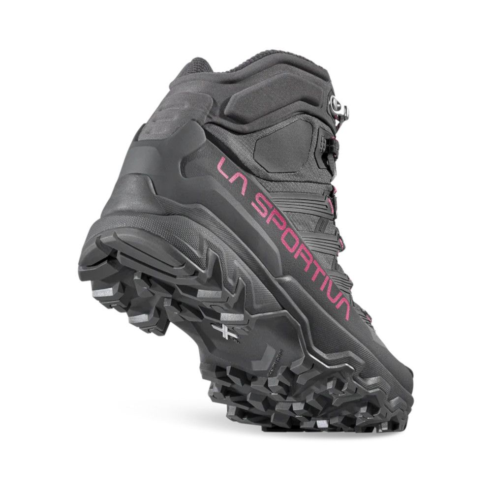 Rugged black hiking boot with a heavy outsole and pink LA SPORTIVA branding.