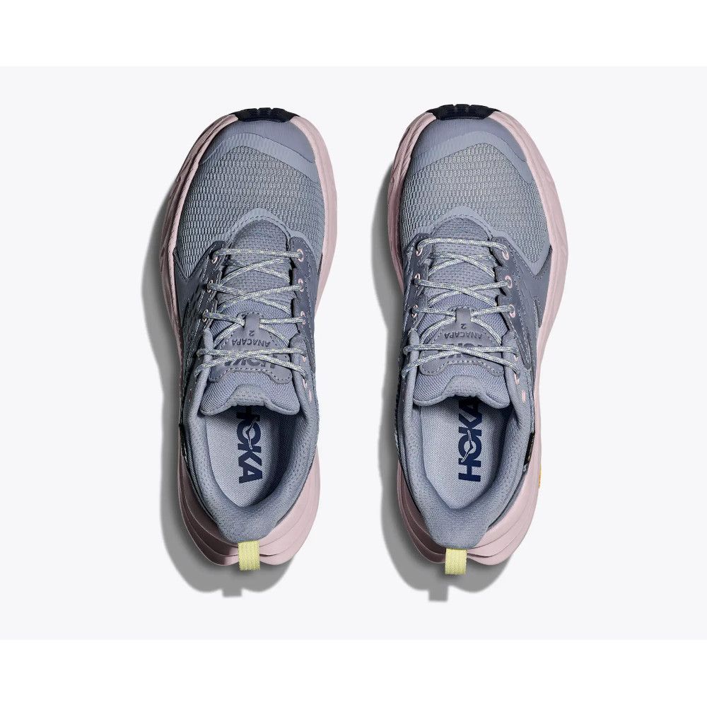 Top-down view of a pair of gray mesh HOKA running shoes with pink soles