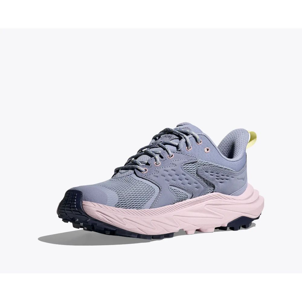 Light purple/gray athletic sneaker with a pink cushioned sole and chunky tread on a white background