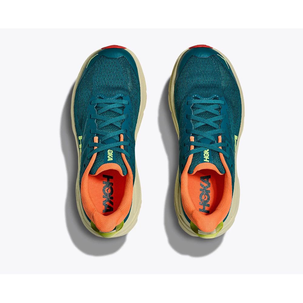 Top-down view of teal running shoes with orange interior lining and light beige soles, placed side by side on a white background.