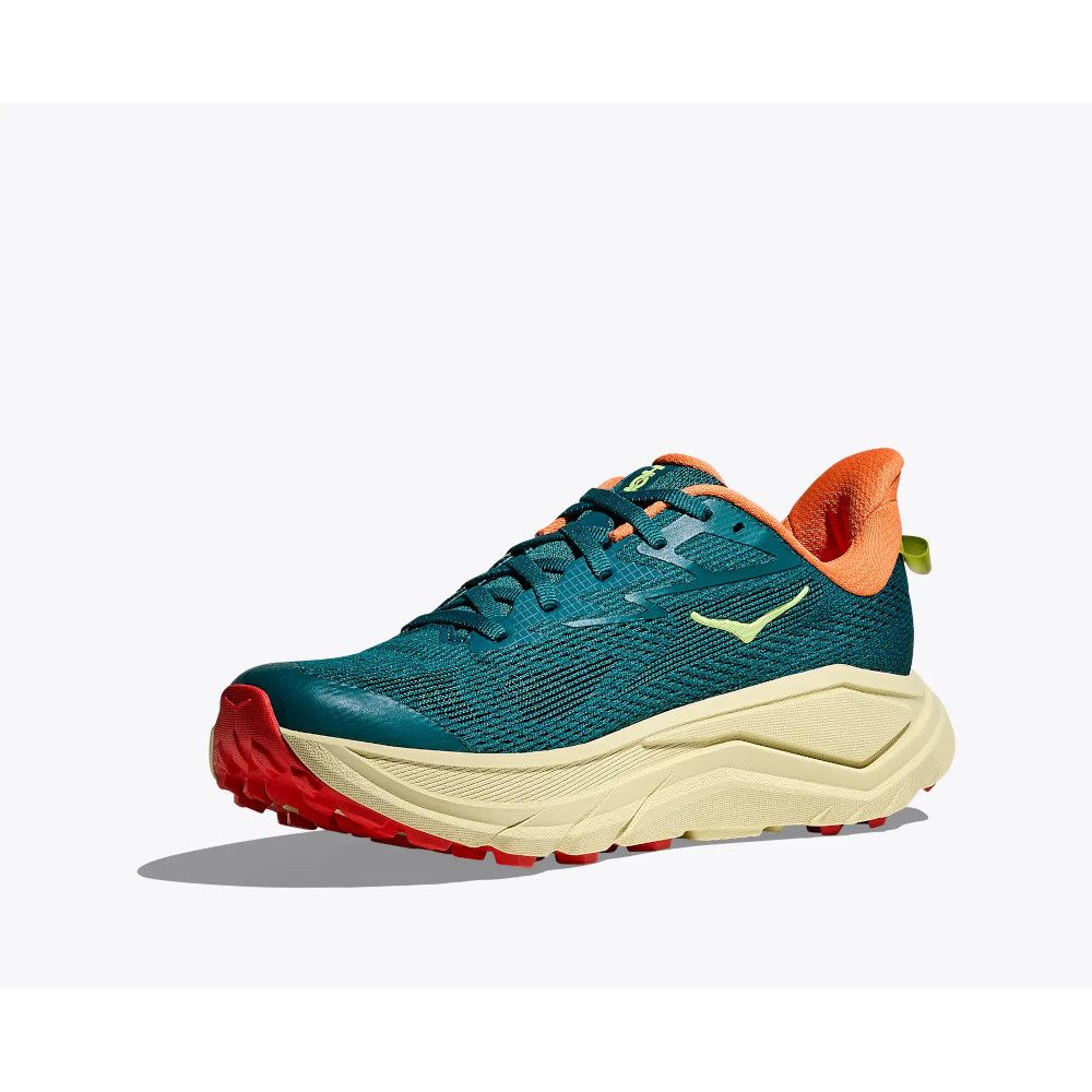 Teal running shoe with orange lining and chunky beige sole, shown in side profile.