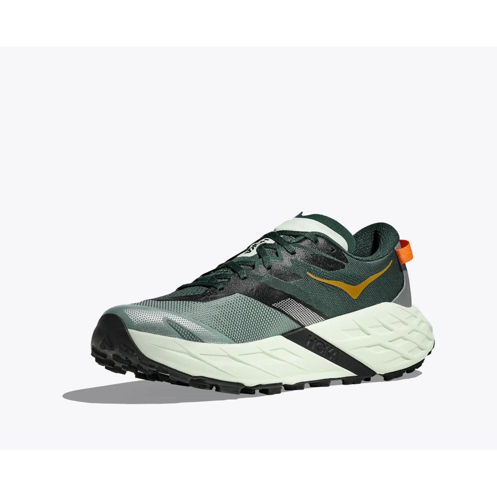 Green and gray trail running shoe with a chunky off-white sole and orange pull tab on back