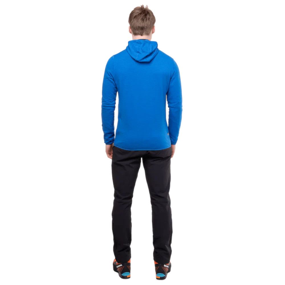 Rear view of a person wearing a royal blue hoodie and black pants on a white background (back view).