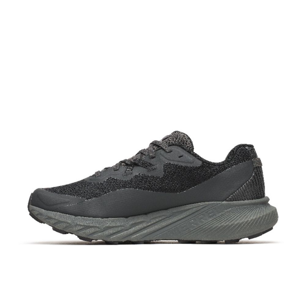 Dark gray and black athletic sneaker with a chunky midsole and knit upper, shown in profile.