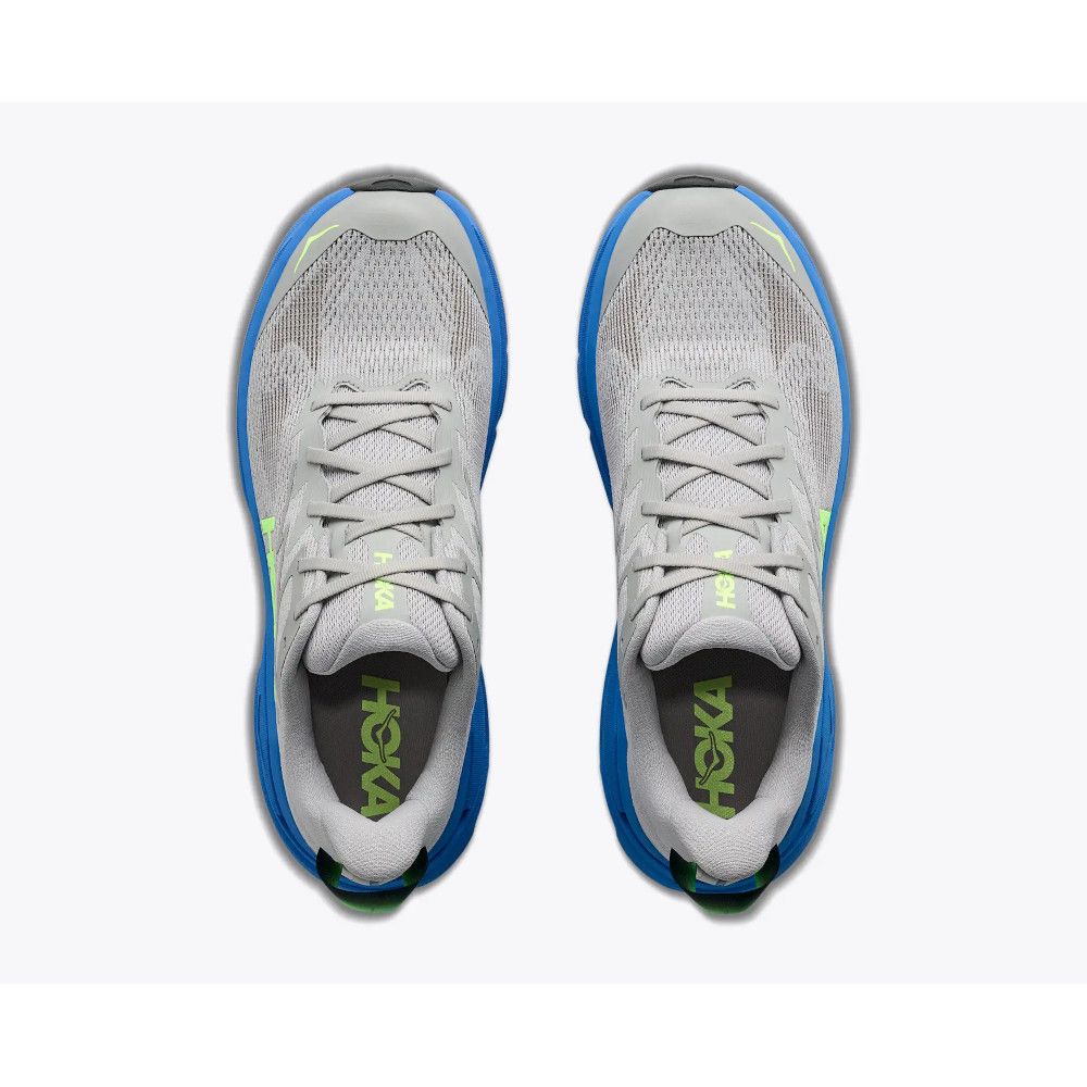 1_43c614ff-305c-487c-b528-744a22aa94cf Top-down view of two gray and blue HOKA running shoes with lime green accents placed side by side.