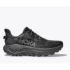 1_43c614ff-305c-487c-b528-744a22aa94cf Black HOKA trail running shoe in profile with a chunky gray midsole and rugged outsole, showing the textured knit upper.