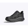 1_43c614ff-305c-487c-b528-744a22aa94cf Black and gray trail running shoe with a chunky rugged sole and textured knit upper, shown from a side angle on a light background with shadow underneath.