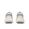 Back view of two light gray knitted sneakers with beige midsoles, shown side by side on a white background.