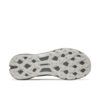 Bottom view of a gray hiking/trail shoe outsole with multi-directional lug pattern and the Merrell logo visible beneath the lugs.