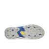 Bottom view of a blue athletic shoe showing a rugged gray outsole with deep lugs and a yellow Vibram logo.