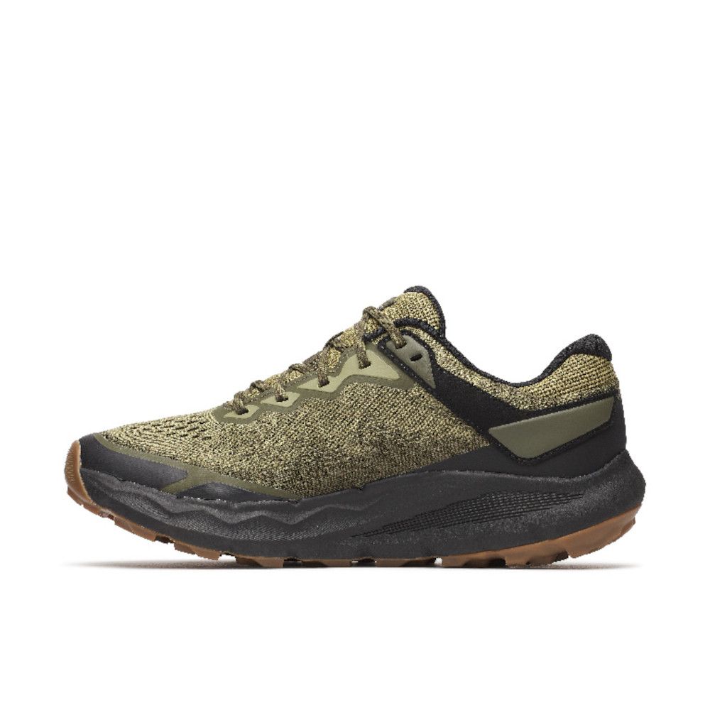 Olive-green woven hiking sneaker with black accents and a gum brown outsole viewed from the side at ground level.