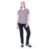 1_43c614ff-305c-487c-b528-744a22aa94cf Woman modeling a lavender short-sleeve T-shirt and black athletic pants with teal-lace sneakers, standing pose.