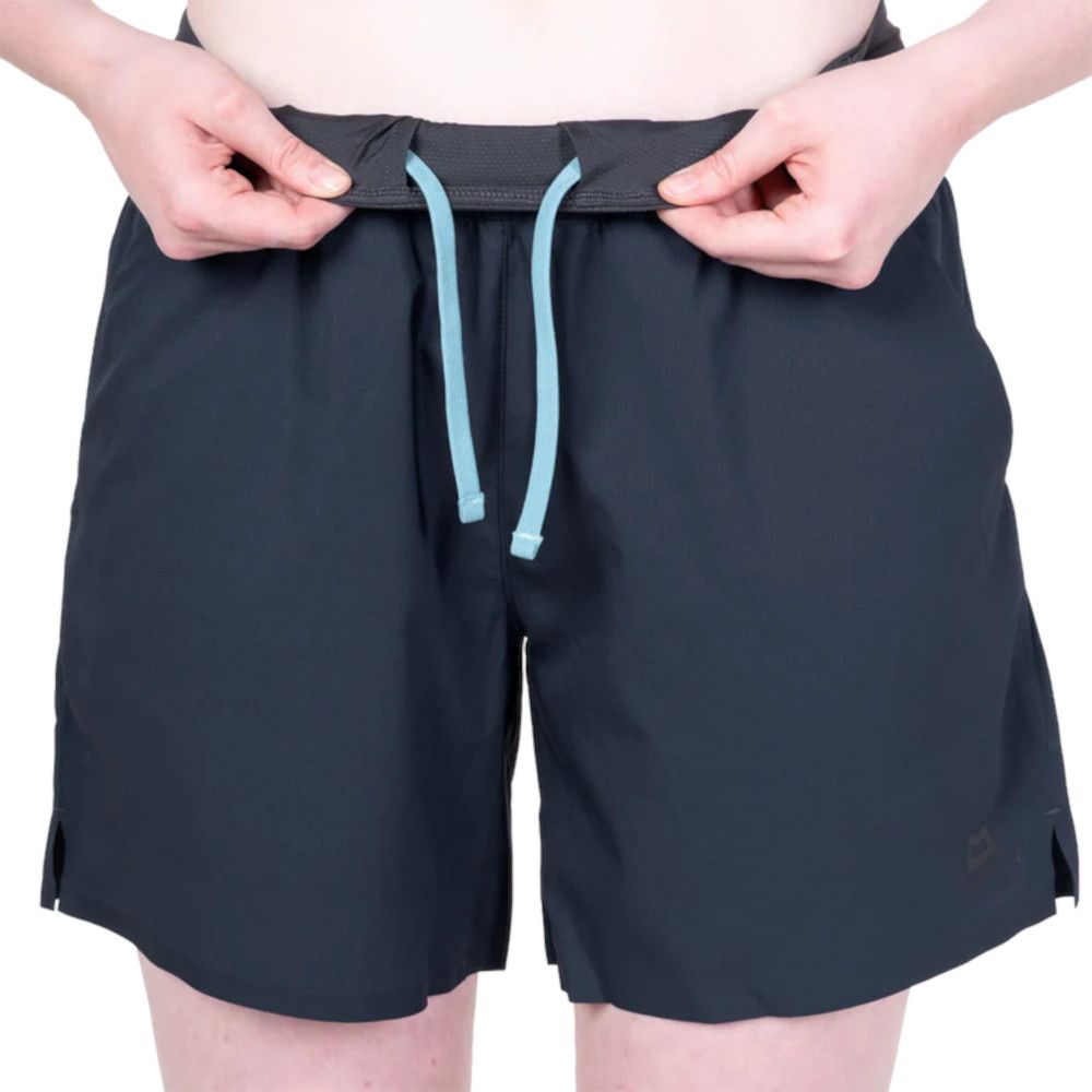 1_43c614ff-305c-487c-b528-744a22aa94cf Dark navy swim shorts with light blue drawstrings being tied at the waist.