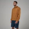 1_43c614ff-305c-487c-b528-744a22aa94cf Man in a rust-orange hooded windbreaker and navy shorts, standing against a neutral backdrop (side profile).