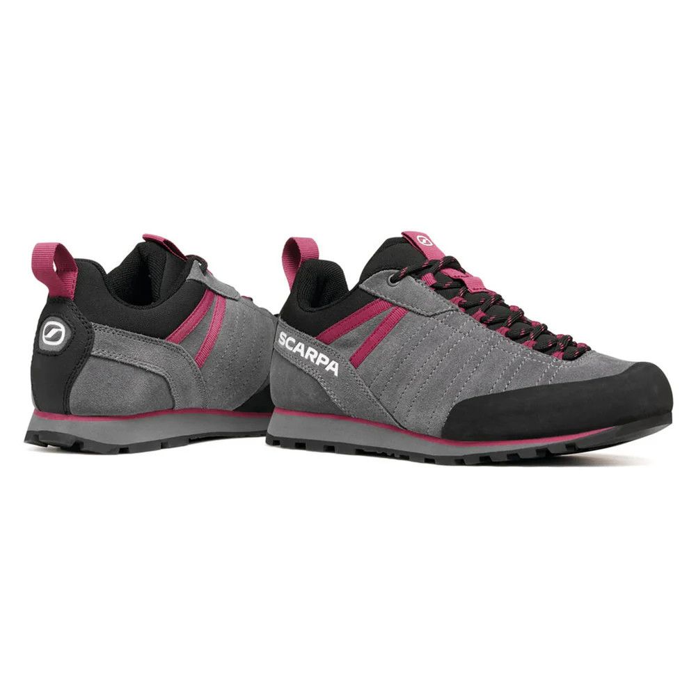 1_43c614ff-305c-487c-b528-744a22aa94cf Grey Scarpa hiking shoe pair with pink accents and black toe cap, side view showing laces and treaded outsole