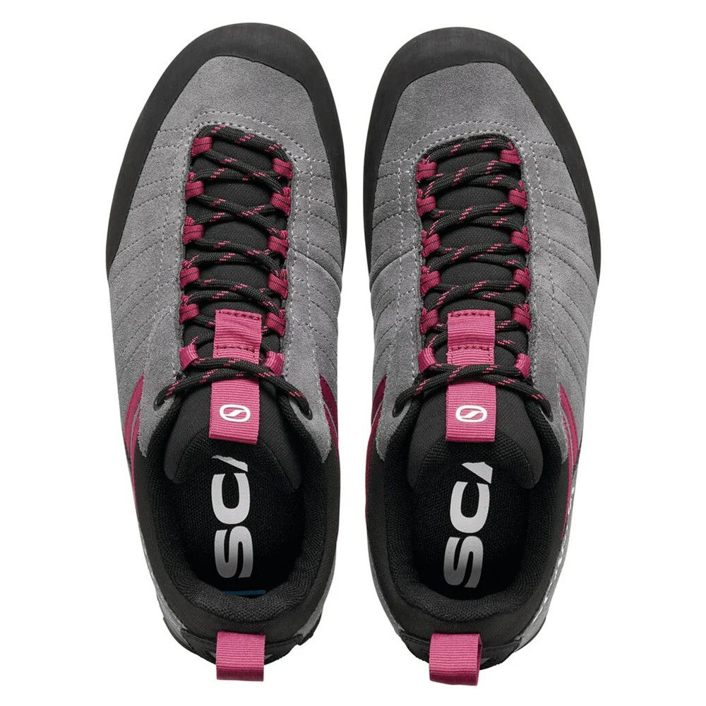 1_43c614ff-305c-487c-b528-744a22aa94cf Top-down view of a pair of gray and black sneakers with pink laces and pull tabs.