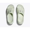 Mint green slip-on clogs (Crocs-style) viewed from above, two shoes side by side.