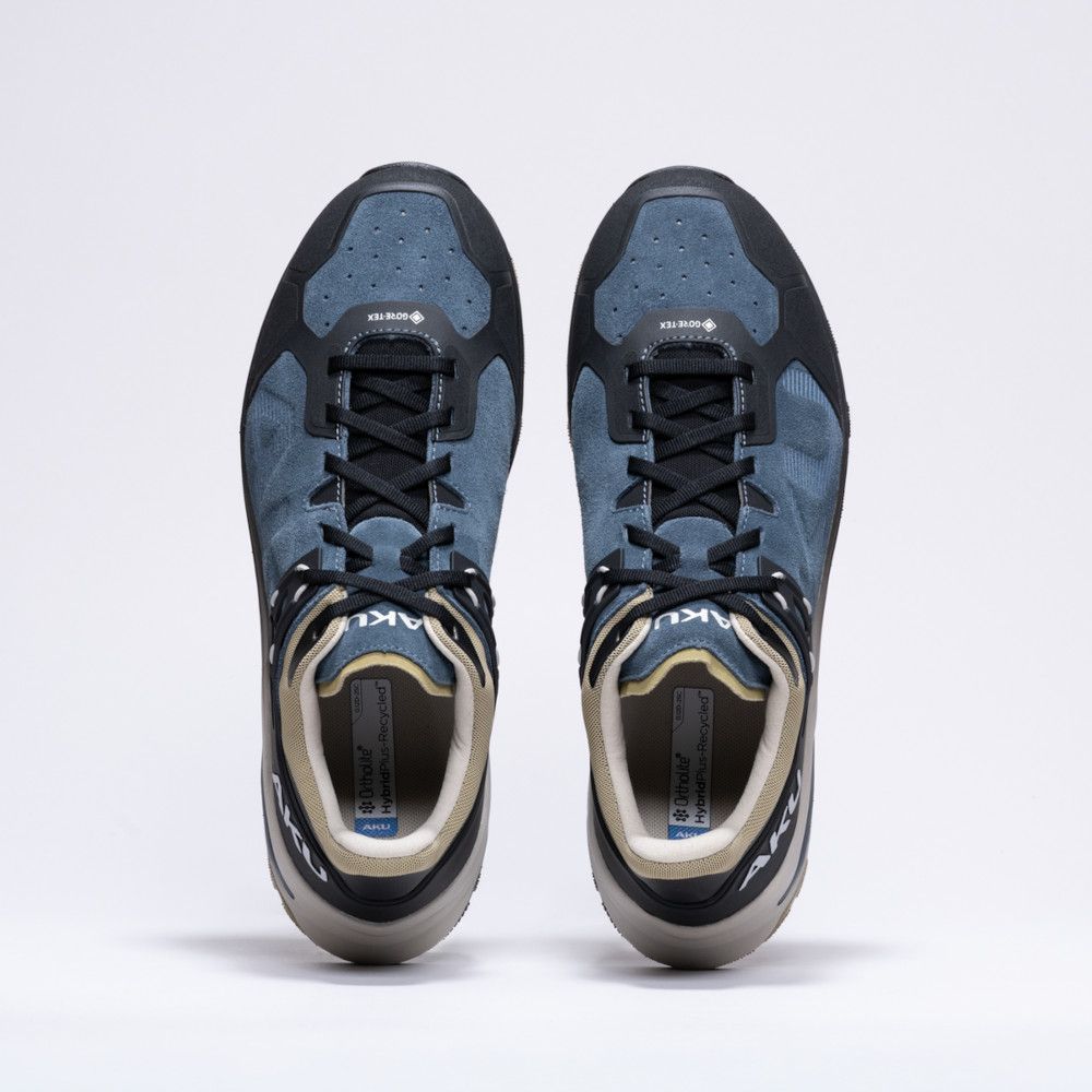 1_43c614ff-305c-487c-b528-744a22aa94cf Pair of blue and gray sneakers viewed from directly above, side by side on a white background.