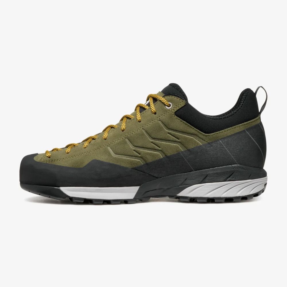 1_43c614ff-305c-487c-b528-744a22aa94cf Olive green hiking shoe with yellow laces and black heel, rugged outsole for trail use, side view.