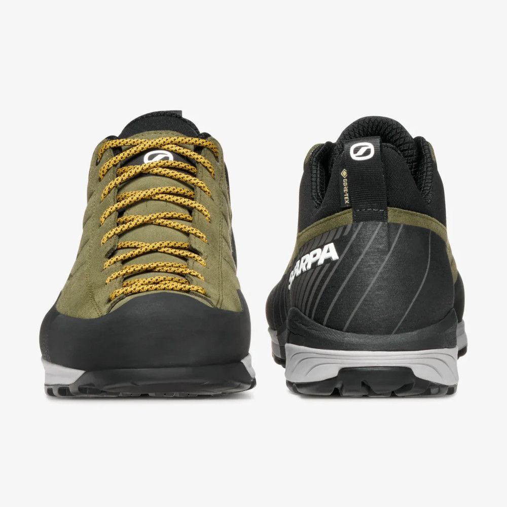 1_43c614ff-305c-487c-b528-744a22aa94cf Olive-green hiking shoes with yellow laces, front view showing rugged black toe cap and grip sole.