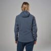 1_43c614ff-305c-487c-b528-744a22aa94cf Back view of a person wearing a blue hooded jacket and dark blue pants, standing against a gray studio backdrop.