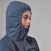 1_43c614ff-305c-487c-b528-744a22aa94cf Person wearing a blue hooded jacket viewed in profile, zipper closed, against a neutral background.