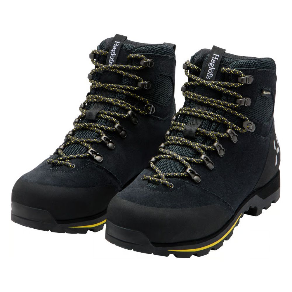 Pair of black hiking boots with yellow-accent laces and rugged tread soles